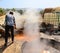 Man working in a factory boiling sugar cane.