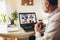 Man working from home having online group videoconference