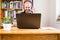 Man working from home office joining teleconference