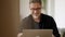 Man working with laptop at home outdoor on terrace