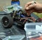 Man working on the radio controlled buggy car model