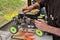 Man working on the radio controlled buggy car model, internal combustion engine, during the regional championship scale 1/8