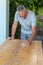 A man working on recycling wood furniture