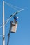 Man working replacing bulb of a lamp post.