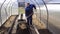 A man works in a vegetable garden in early spring