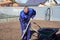 A man works in a vegetable garden in early spring