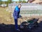 A man works in a vegetable garden in early spring