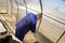 A man works in a vegetable garden in early spring. Digs the ground. Working in a greenhouse