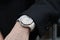 Man wrist with Audemars Piguet Royal Oak luxury watch with diamonds before Fendi fashion show, Milan Fashion