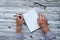 Man writing in notepad, using his left hand. Conceptual photo of lefthanded day. Mock up notepad. Top view. Copy space.