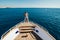 Man on a yacht. Beautiful view from a bow of a yacht at seaward. Sailing. Luxury yachts. Summer vacation and voyage concept