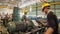Man In Yellow Cap - Working on A Metal Cutting Machines - Timelapse - Tilt