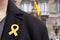 Man with a yellow ribbon in Barcelona, Spain