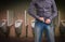 Man zip his pants up after peeing on the public toilet