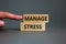 Manage stress and be health symbol. Wooden blocks with words \'manage stress\'