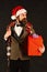 Manager with beard holds red gift. Man in smart suit