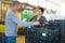 Manager checks number of cucumber crates in farm warehouse