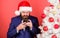 Manager congratulate colleagues online. Read christmas greeting. Man bearded hipster wear formal suit and santa hat hold