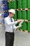 Manager in a logistic company work in a warehouse with chemicals