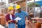 Manager and worker of construction store keep records of brick