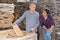 Manager and worker of construction store keep records of natural stone tiles