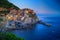 Manarola, Liguria, Italy. The wonderful Manarola village. Quiet sky and peaceful sea, during sunset.