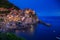 Manarola, Liguria, Italy. The wonderful Manarola village. Quiet sky and peaceful sea, during sunset.