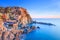 Manarola village, rocks and sea at sunset. Cinque Terre, Italy