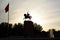 Manas statue silhouette at sunset. Ala Too square. Bishkek. Kyrgyzstan