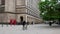 Manchester centre. Blurred view of people walking past Central Library