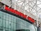 Manchester United's football stadium with the teams name sign in red