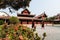 Mandalay, Myanmar - April 2019: Buddhist monks walking in the backyard of Royal Palace