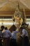 MANDALAY, MYANMAR - MAY 4, 2017: Buddhists paste gold leaf of Mahamuni Buddha, Mandalay, Myanmar