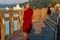 Mandalay, Myanmar - Nov 12, 2019: Monk at U Bein bridge in Amarapura