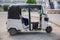 MANDALAY, MYANMAR - October 18, 2018. Three wheeled motor rickshaw is parking on the road side