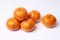 Mandarin-Honey Murcott oranges on white background.