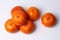 Mandarin-Honey Murcott oranges on white background.