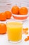 Mandarin juice in a glass and ripe mandarins