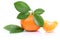 Mandarin orange tangerine slices with leaves isolated