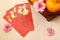 Mandarin oranges in basket with Chinese New Year red packets - Series 3