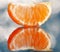 Mandarin oranges and cloves on blurred background