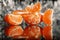 Mandarin oranges and cloves on blurred background freshness