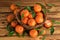 Mandarin organic fruits on a old wooden background