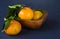 Mandarine fruite with leaves on a blue background