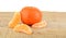 Mandarine with pieces on wooden table