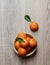 Mandarine tangerine group in wooden dish ripe and fresh with leaf on wooden background
