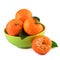 Mandarins fruit in green cup on white background.Organic fruits with leaves