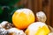 Mandarins, walnuts and bumps in a basket on the background of a Christmas tree.