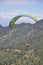 Mandi, Himachal Pradesh, India - 10 16 2021: A young guy enjoying paragliding with professional pilot in the sky