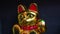 Maneki Neko, Japanese Lucky Cat. Golden cat brings good luck and wealth